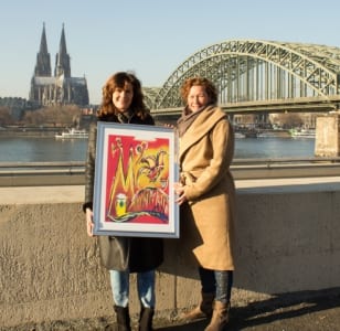 Britta Winnat und mit Poster und Dom. Foto: 